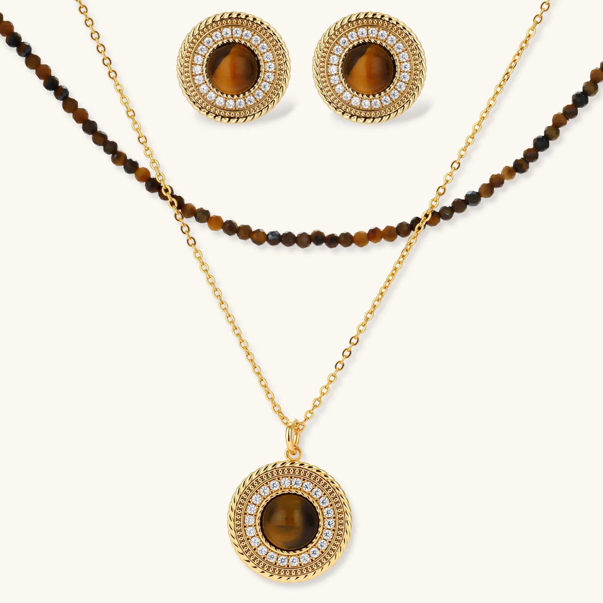 Gold plated eco-brass set with brown cat-eye stone pendant, beaded brown necklace and matching round zirconia halo stud earrings.